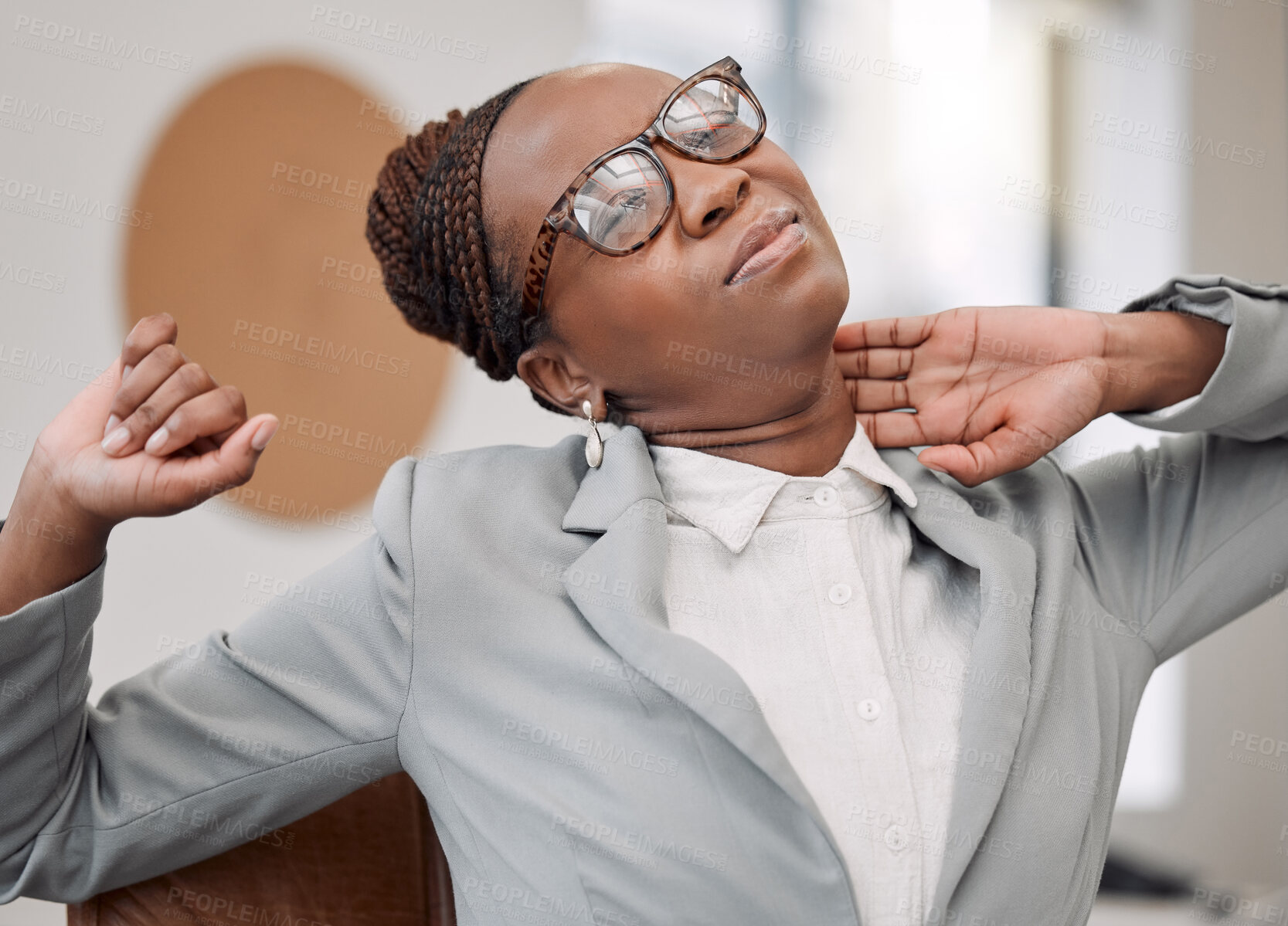 Buy stock photo Shot of a young businesswoman experiencing neck pain while working in an office