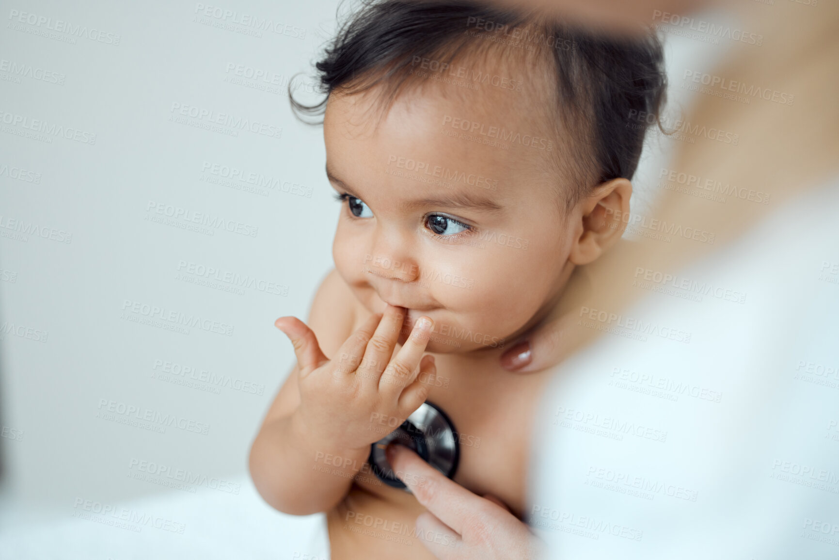 Buy stock photo Baby, stethoscope and hands of doctor in clinic for check up, heartbeat and progress for growth. Child, pediatrician and healthcare with equipment for post natal assessment, development or cardiology
