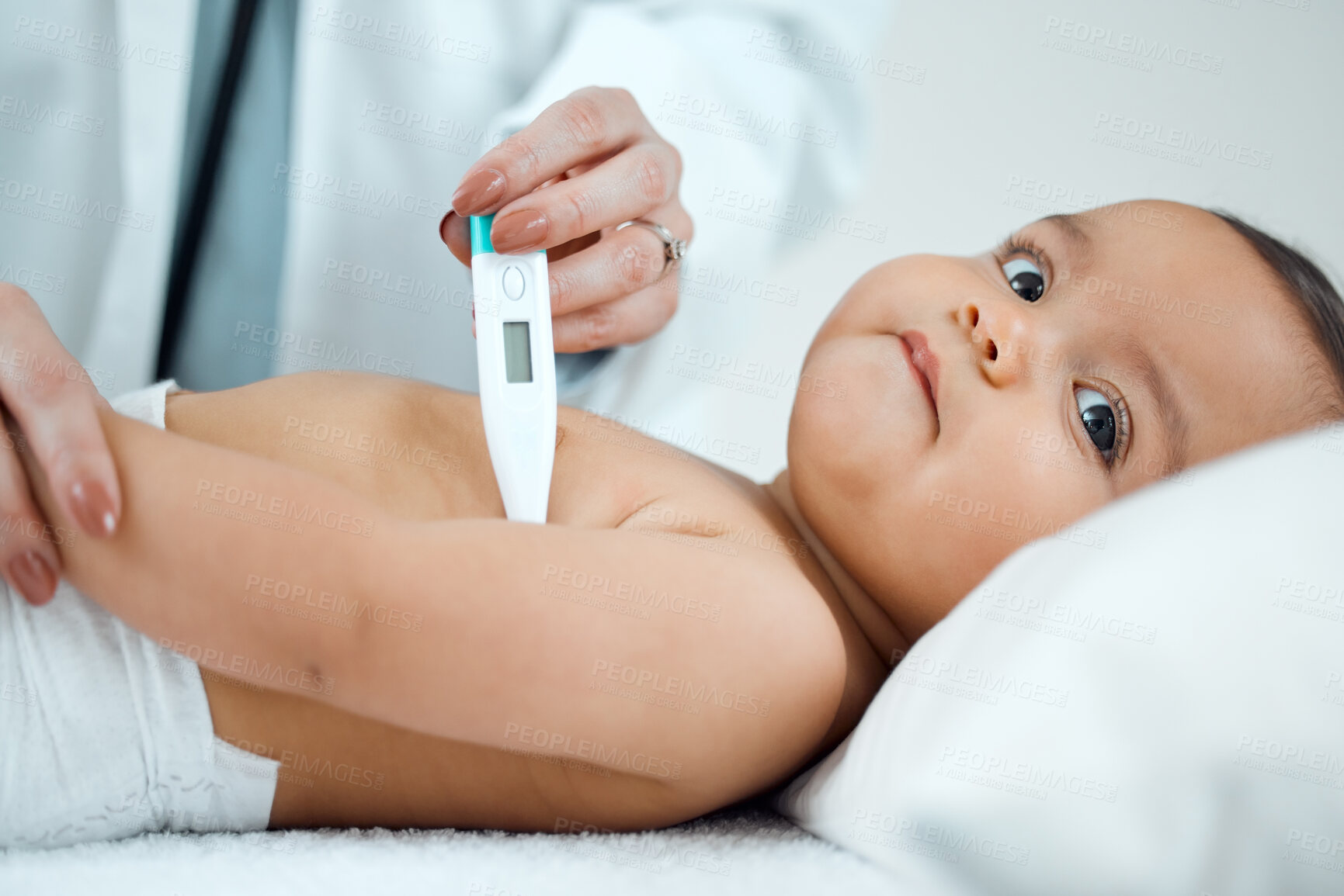 Buy stock photo Shot of a paediatrician taking a baby's temperature with a thermometer in a clinic