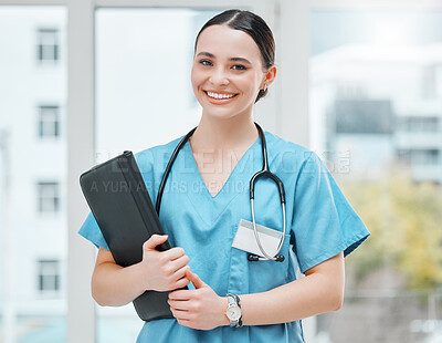 Buy stock photo Shot of a young female doctor working in a hospital
