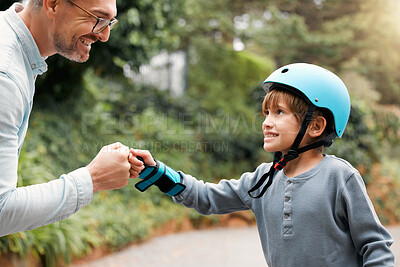 Buy stock photo Shot of a little boy and his father sharing a fist bump