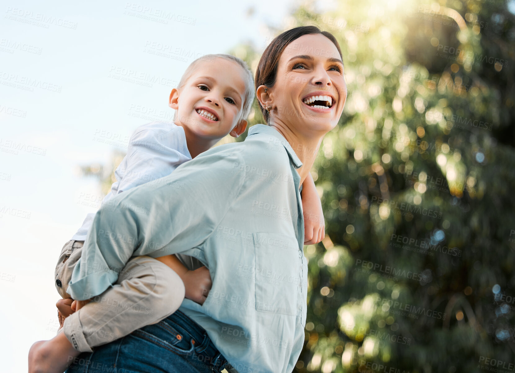 Buy stock photo Portrait, mom and piggyback boy in outdoor for bonding activity, playful fun and childhood happiness in park. Mother, child and back hug in nature for sunshine adventure, weekend break and affection.