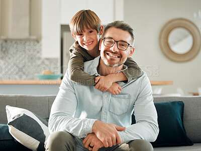 Buy stock photo Sofa, son and hugging father in portrait, peace and single parent love for boy in living room. Daddy, kid and embrace for security on couch for care in childhood, relationship and comfortable home