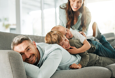 Buy stock photo Father, kids and pile in home portrait, peace and parents love for boys in living room. Family, children and stack for resting on couch or mother tickling son, relationship and comfortable bonding