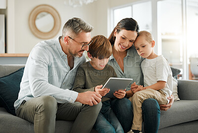 Buy stock photo House, family and parents with tablet, kids and typing for entertainment, fun and connection. Apartment, mother or father with children, technology or digital app for game, relax or online reading