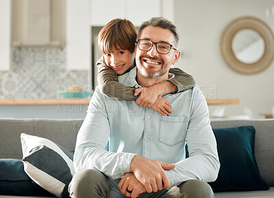 Buy stock photo Happy, son and hugging dad in portrait, peace and single parent love for boy in living room. Daddy, kid and embrace for security on couch for care in childhood, relationship and comfortable home