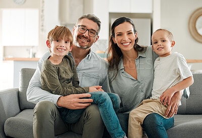 Buy stock photo Family portrait, kids and hug in home for support, peace and connection for bonding on sofa. Parents, children and embrace for security on couch for care in childhood, relationship and comfortable