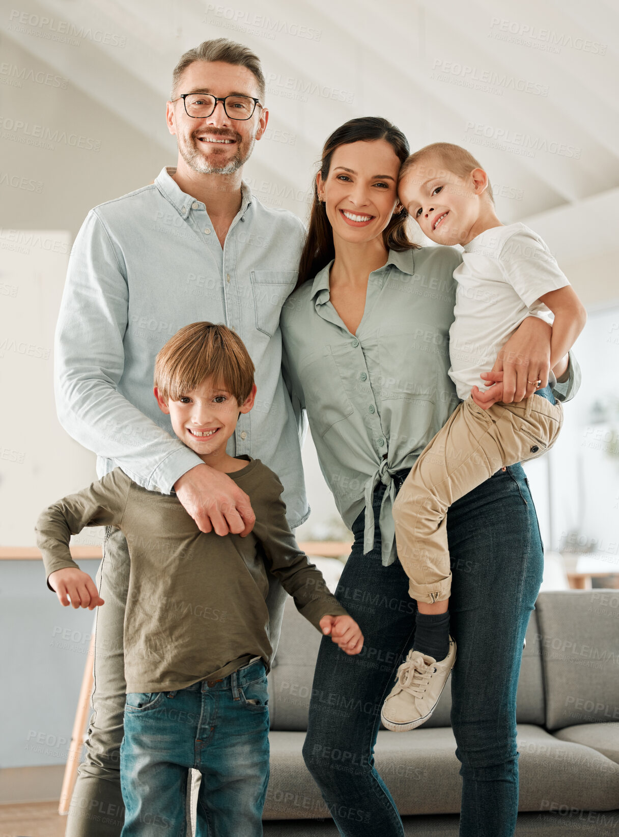 Buy stock photo Family portrait, kids and hug in home for safety, peace and connection to boys in living room. Parents, children and embrace for trust or care in childhood, relationship and comfortable or support