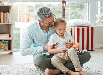Buy stock photo Shot of a father and son playing at home