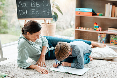 Buy stock photo Shot of a mother and son playing in the lounge at home