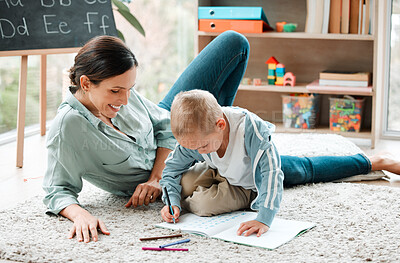 Buy stock photo Shot of a mother and son playing in the lounge at home