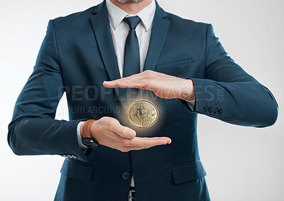 Buy stock photo Hands, business man and cryptocurrency in studio isolated on white background. Gold, digital money and coin float with trader in suit on blockchain market for financial investment, mining or banking