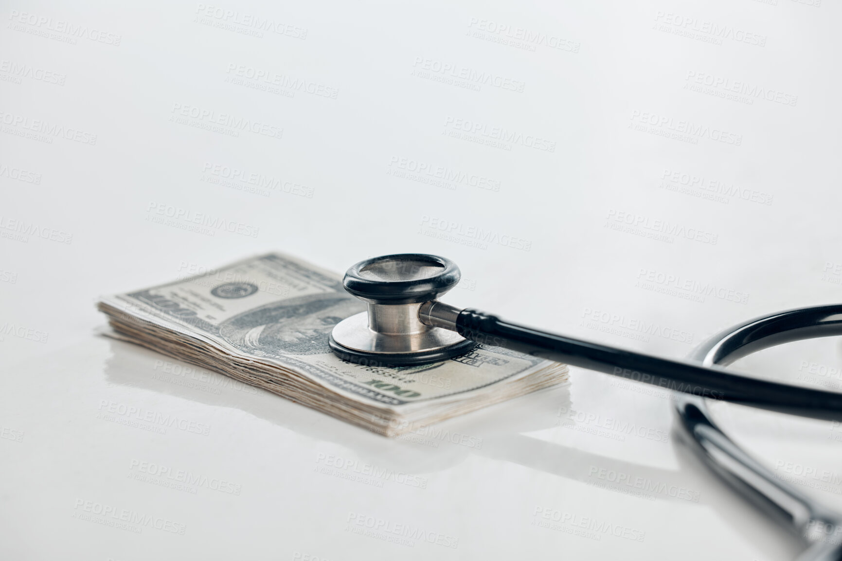 Buy stock photo Bank note, stethoscope and money for healthcare with hospital budget, medical fund and finance in studio. Cash, paper bills and insurance crisis for poverty, inflation and debt by white background