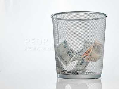 Buy stock photo Cash, dollar and waste basket of paper currency from crime, fraud and money laundering in studio. Garbage, bin and financial bankruptcy and debt from bad investment and inflation with fake notes scam