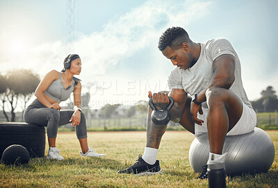 Buy stock photo Full length shot of a young athletic couple exercising together outdoors
