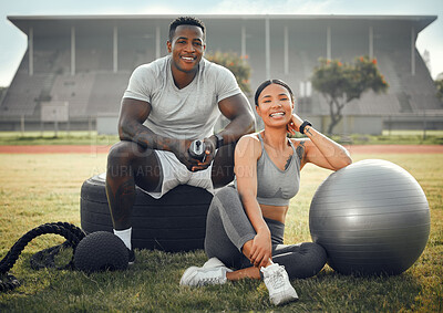 Buy stock photo Cropped portrait of an athletic young couple sitting together outside during their workout
