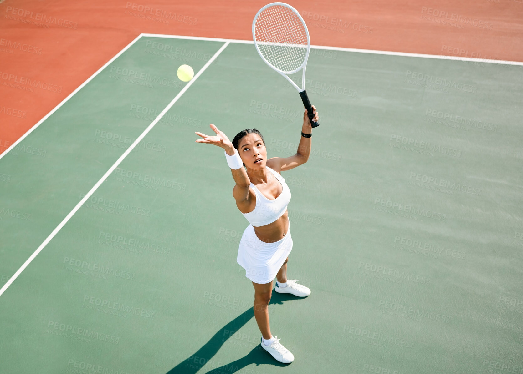 Buy stock photo Serving, tennis player or woman in game for match, workout or sports exercise on outdoor court. Hobby, ball or above of girl athlete with racket ready for playing, fitness training or practice skills