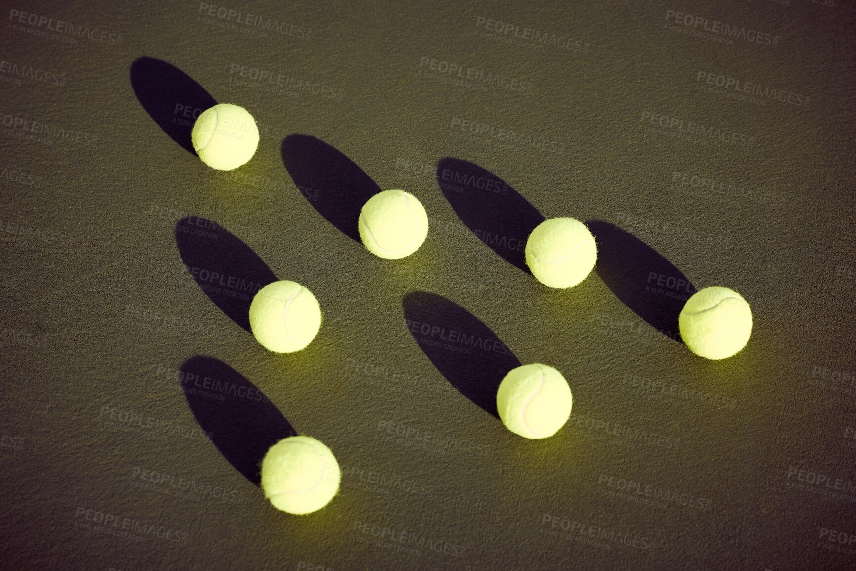 Buy stock photo Shot of tennis balls lying on a tennis court