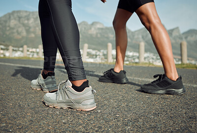 Buy stock photo Shot of two women jogging together