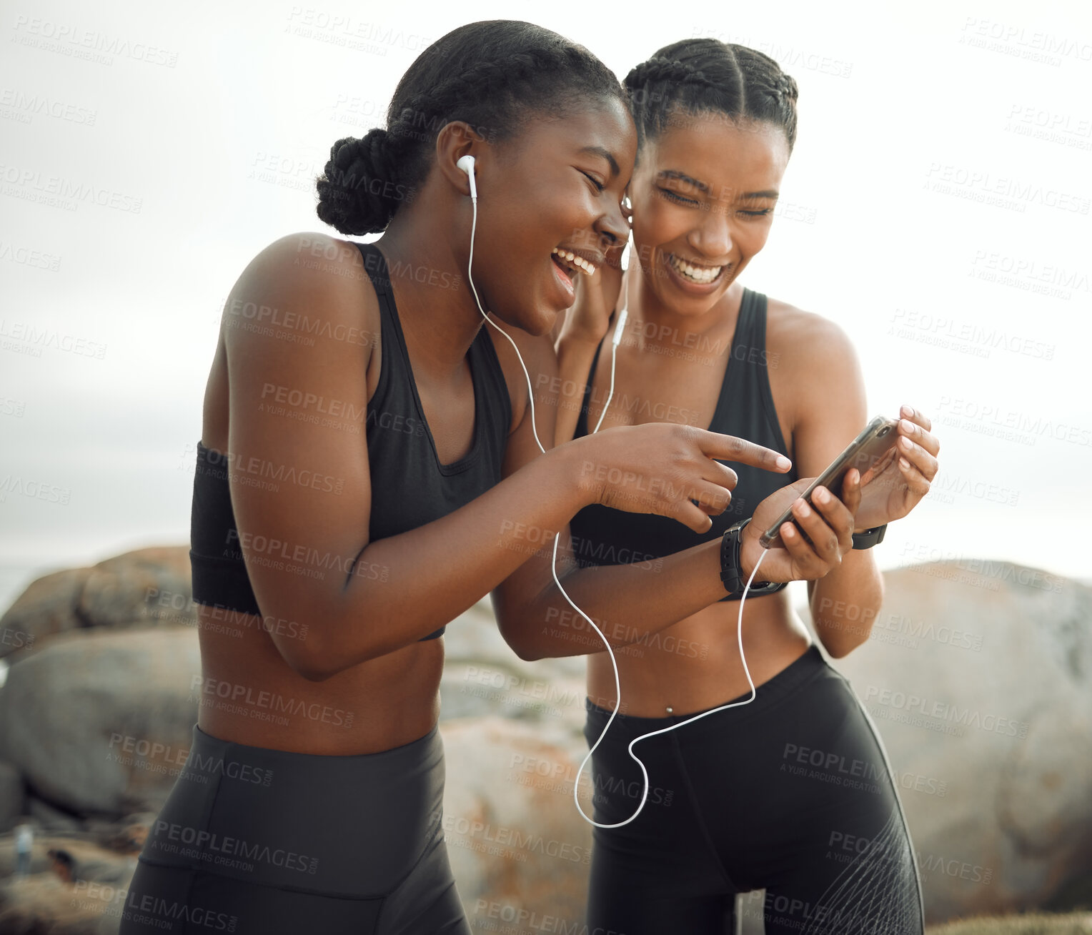 Buy stock photo Friends, women and smartphone with earphones for fitness on break with exercise, running and workout in Atlanta. Beach, music and happy with funny videos on social media for entertainment and fun