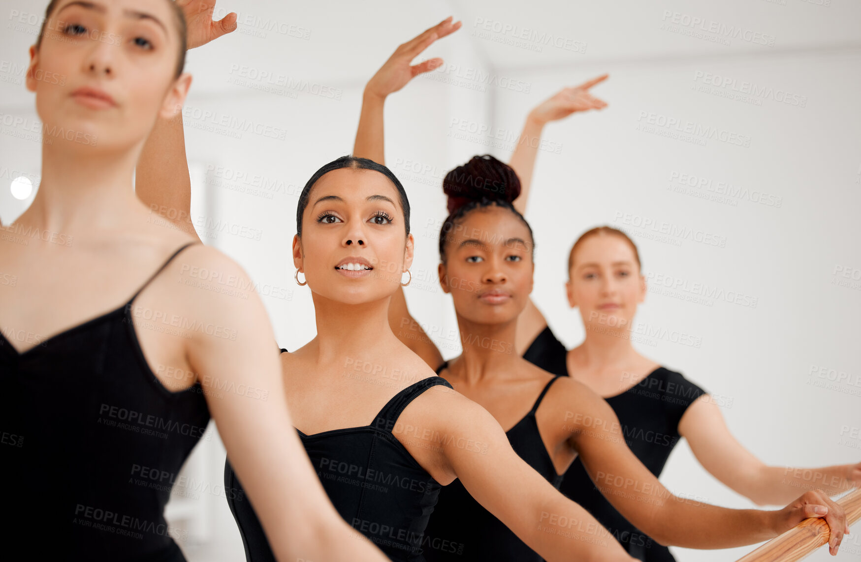 Buy stock photo Ballet, group and women stretching in studio for fitness, balance exercise and body flexibility. People, dancer and warm up for training, talent and performance together in dancing class of rehearsal