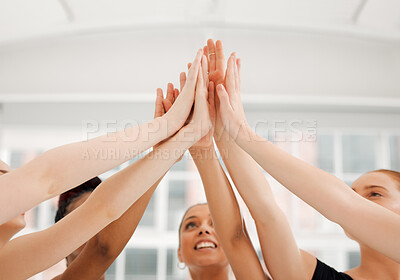 Buy stock photo Shot of a group of ballet dancers giving a high five while standing together