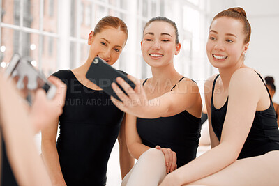 Buy stock photo Shot of ballerinas taking selfies together with a smartphone with relaxing on break