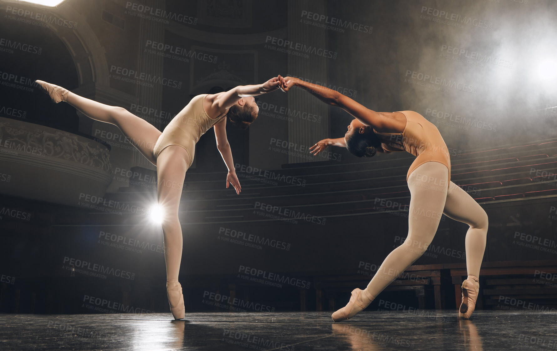 Buy stock photo Shot of a group of ballet dancers practicing a routine on stage