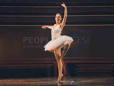 Buy stock photo Shot of a young woman practicing her routine in a stage