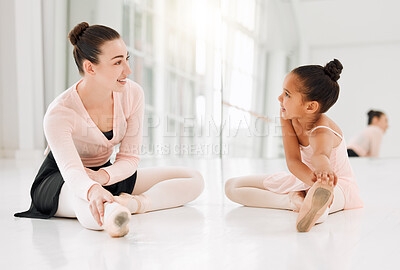 Buy stock photo Shot of a ballet teacher and student taking a break and talking on the floor of a dance studio