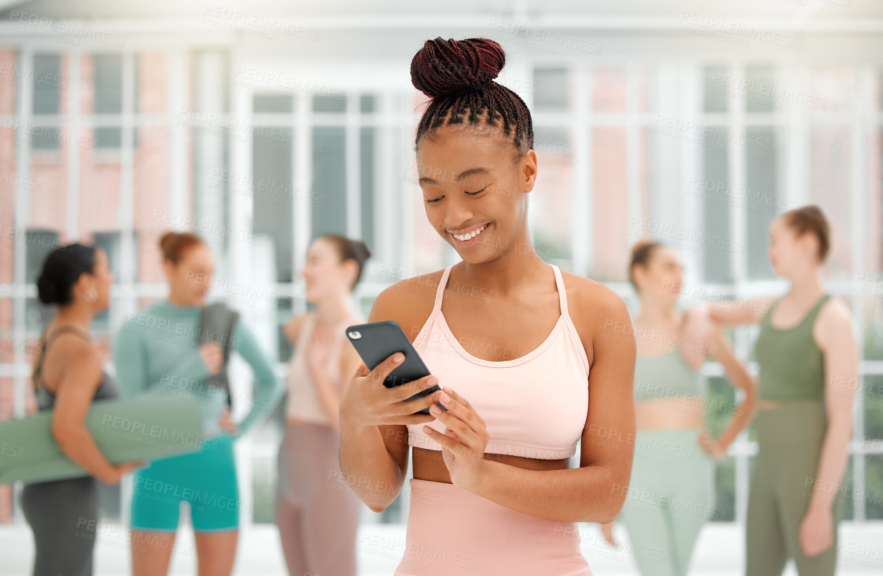 Buy stock photo Happy, phone and girl in gym class for fitness, contact and online transport service. Yoga session, woman or smile at mobile for text message, social media update or pilates studio review on internet