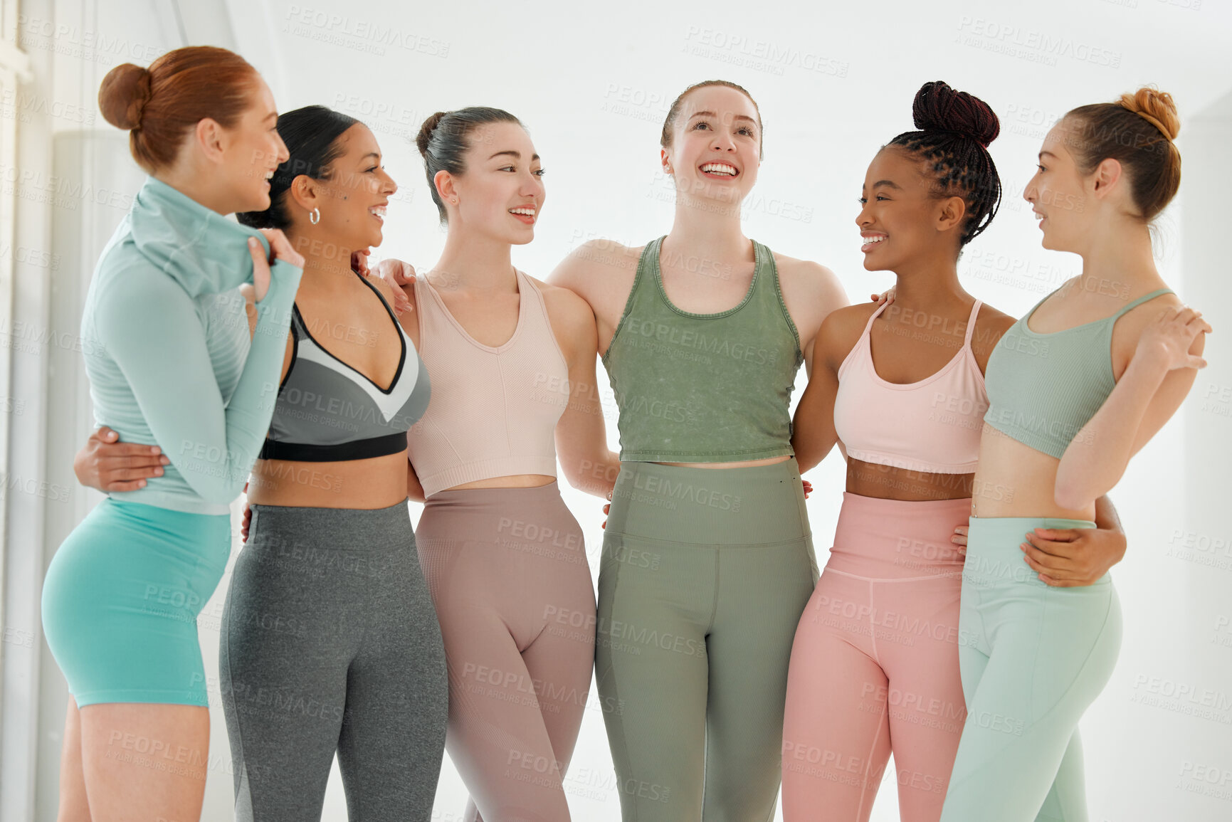 Buy stock photo Shot of a group women standing together in their workout clothes