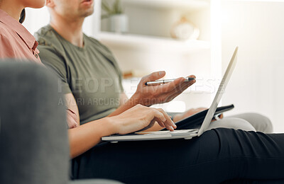 Buy stock photo Shot of two unrecognizable people working at home