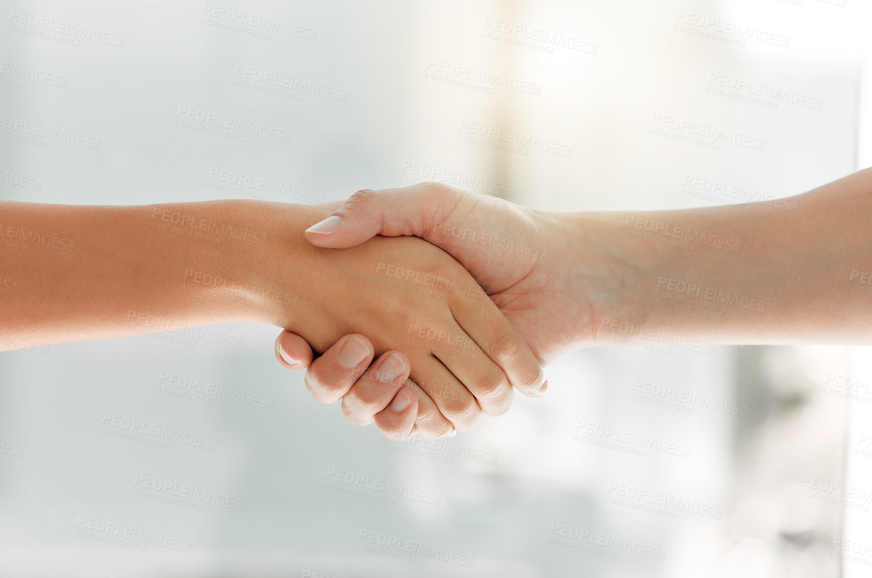 Buy stock photo Shot of two unrecognizable people shaking hands at home