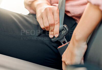 Buy stock photo Closeup shot of a woman fastening her seatbelt in a car
