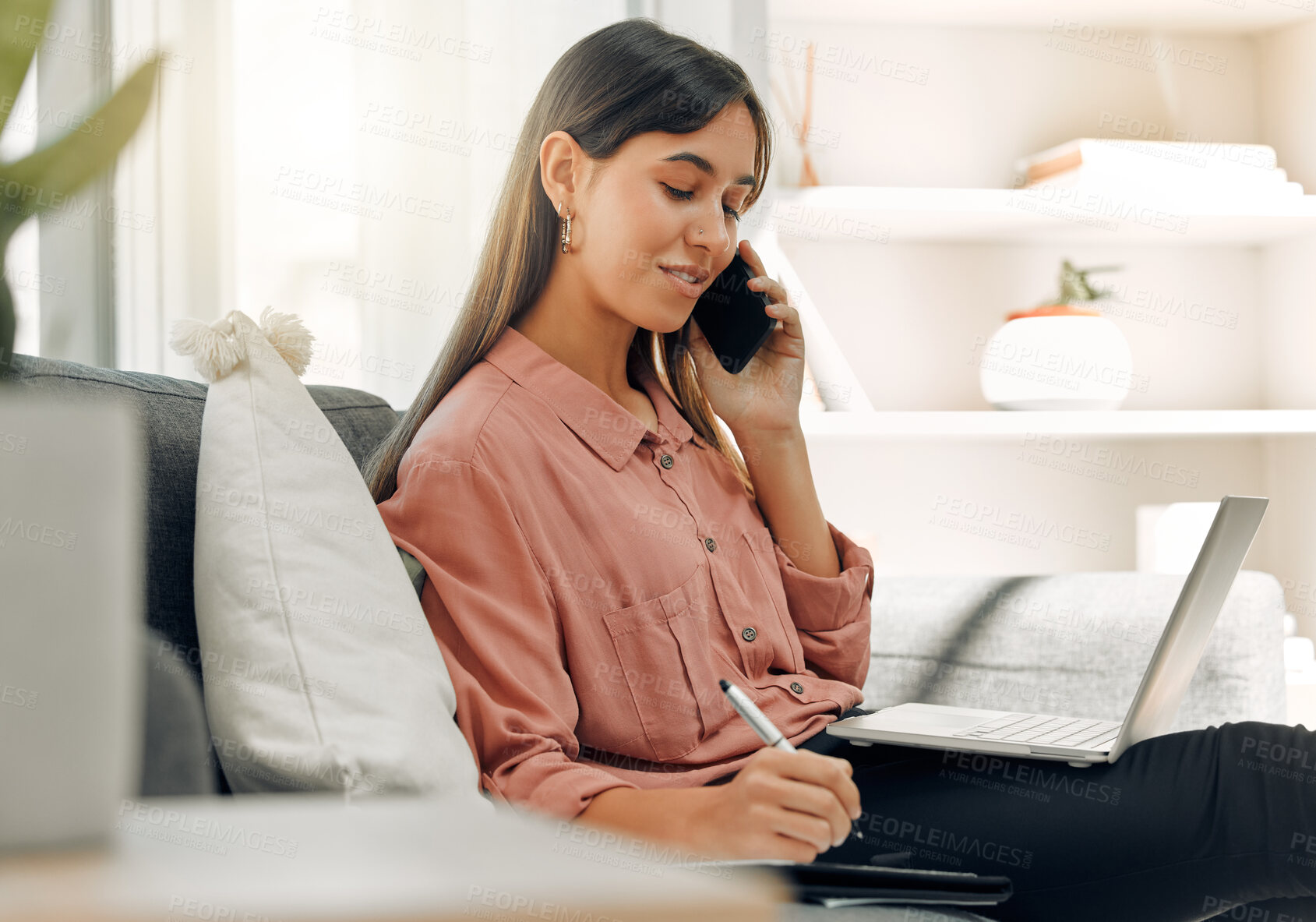 Buy stock photo Laptop, notebook and phone call with remote work woman on sofa in living room of home for communication. Computer, thinking and writing with happy person talking on mobile in apartment for freelance