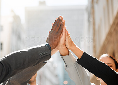 Buy stock photo Shot of a group of businesspeople high fiving one another