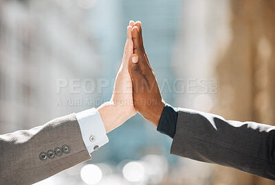 Buy stock photo Shot of two business people giving each other a high five