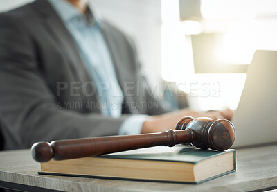 Buy stock photo Shot of a lawyer working on his laptop