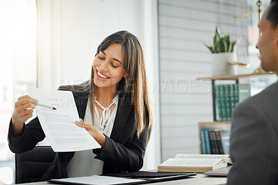 Buy stock photo Shot of a female lawyer helping her client sign a contract