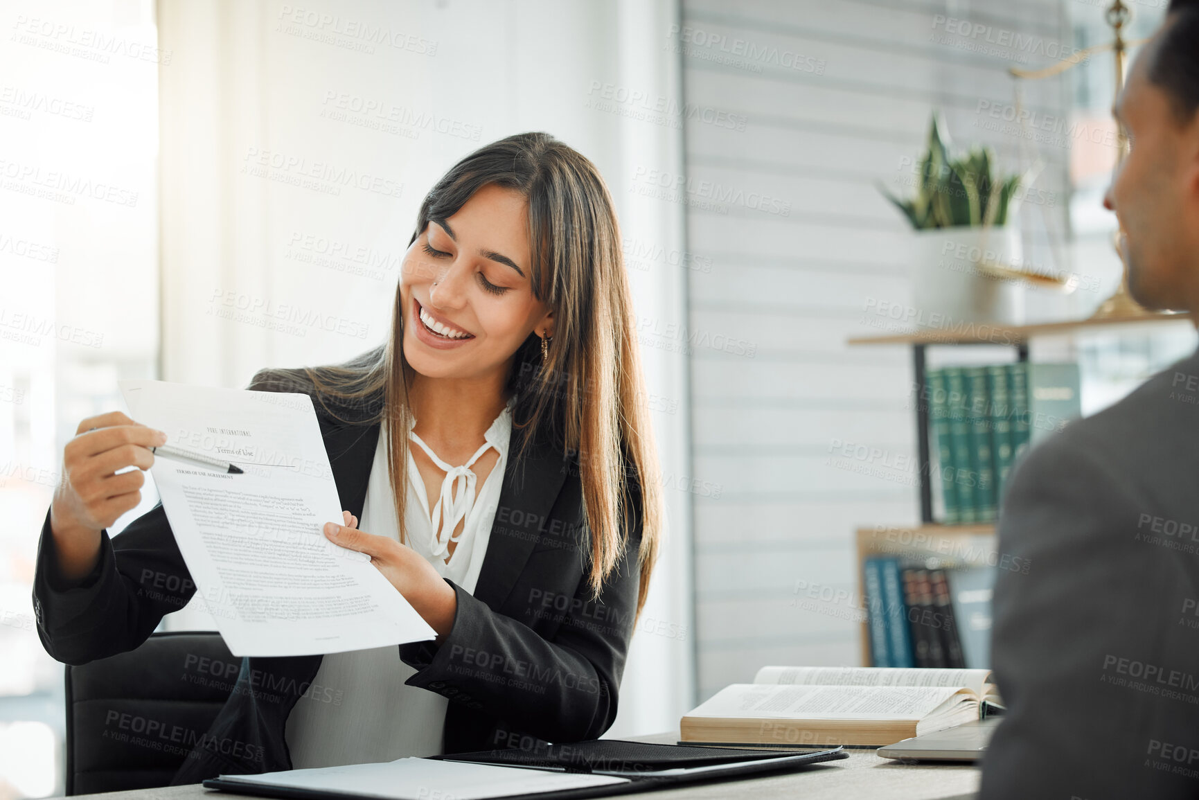 Buy stock photo Shot of a female lawyer helping her client sign a contract