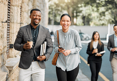 Buy stock photo Shot of two lawyers walking to work while having a conversation