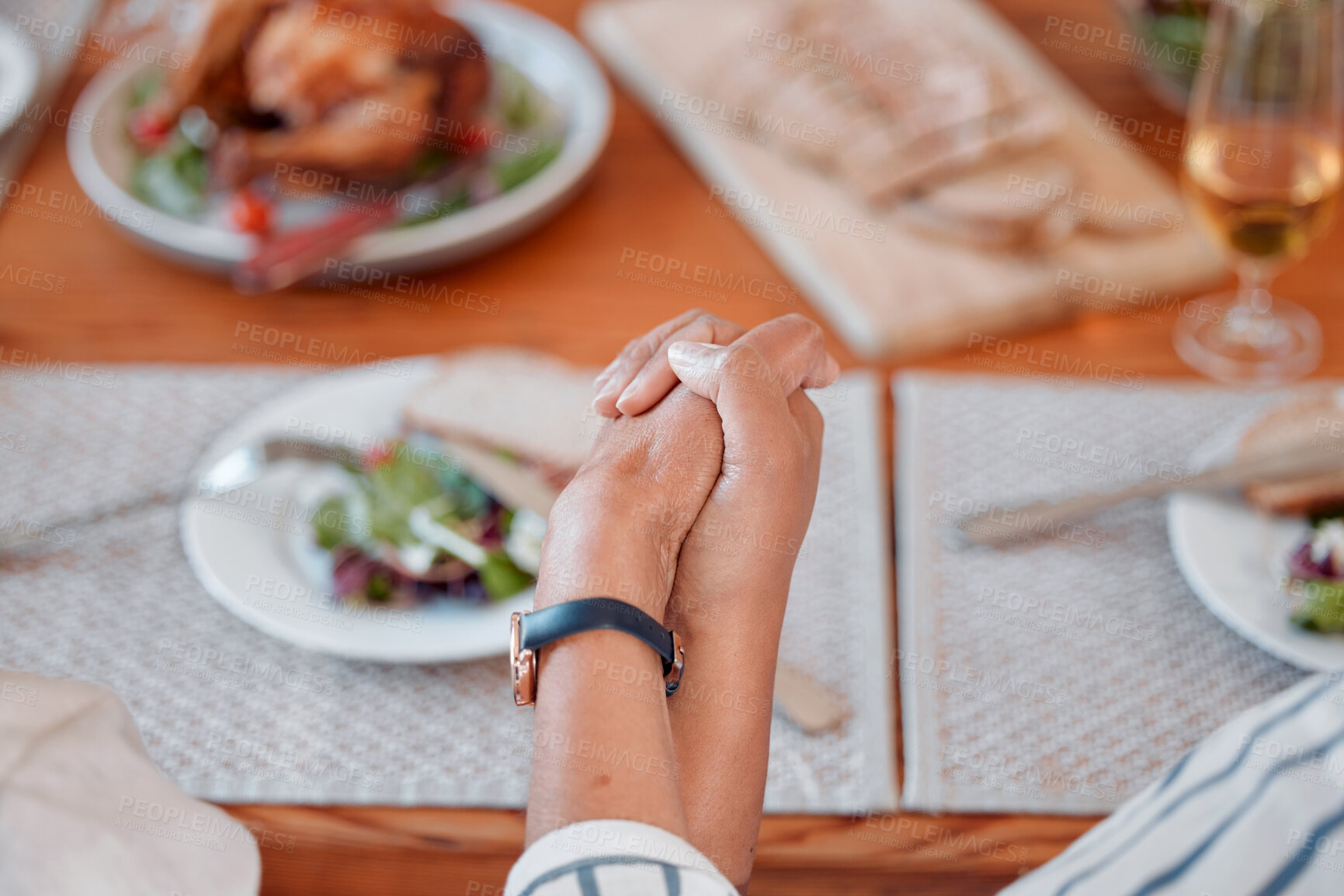 Buy stock photo People, holding hands and worship at family dinner or table for tradition, gratitude or blessing food for eating. Thanksgiving, closeup and pray in home for festive holiday, thankful and appreciation