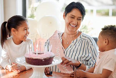 Buy stock photo Shot of a mature woman celebrating her birthday with family at home