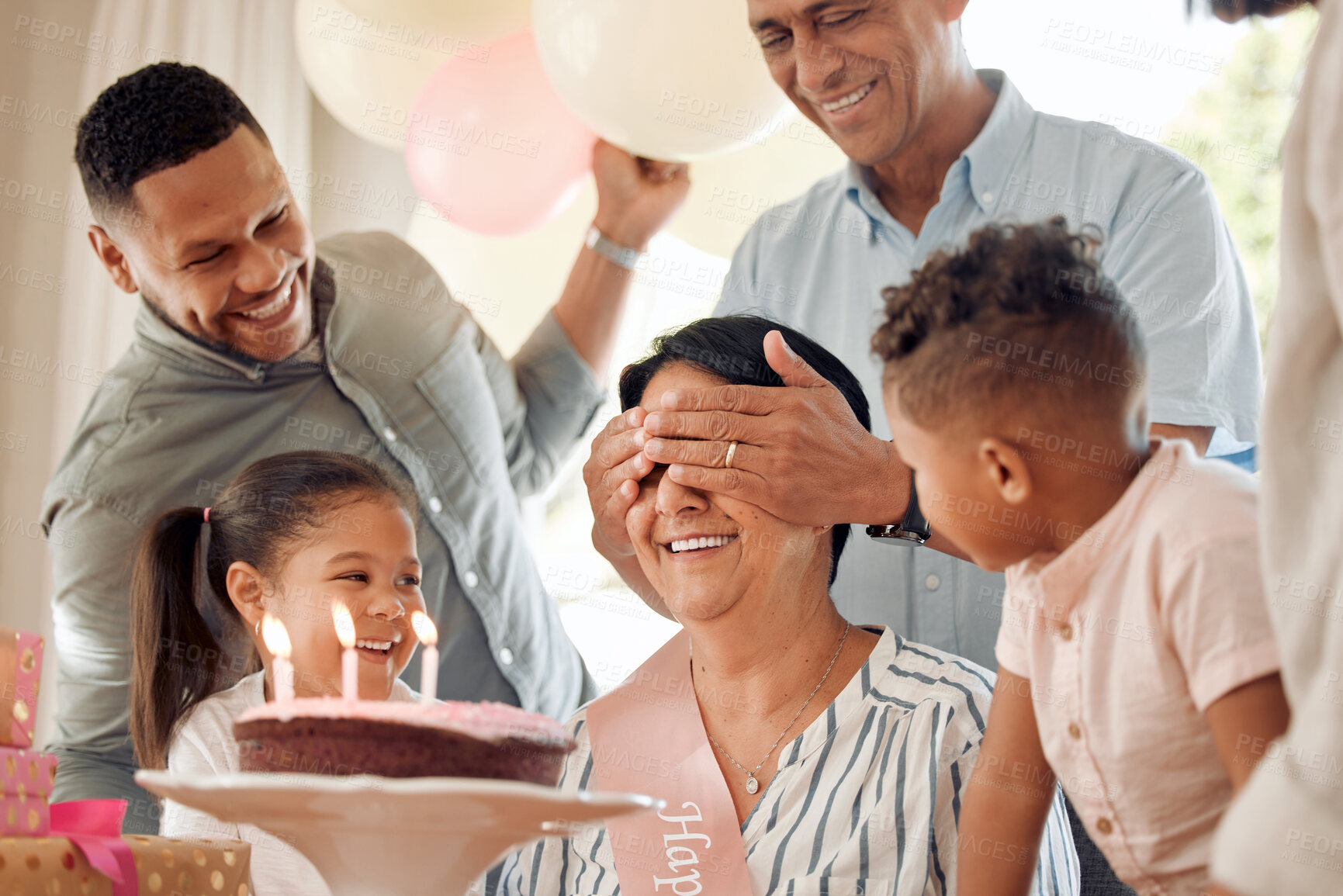 Buy stock photo Birthday, happy or surprise grandmother with cake for celebration, milestone or fun at party. Generations, people or event at home for mature mother with candles, gifts and closing eyes in excitement