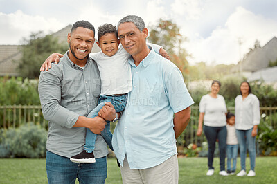 Buy stock photo Shot of a father and grandpa holding a little boy in the yard
