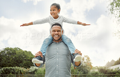 Buy stock photo Shot of a father and son playing in the yard outside