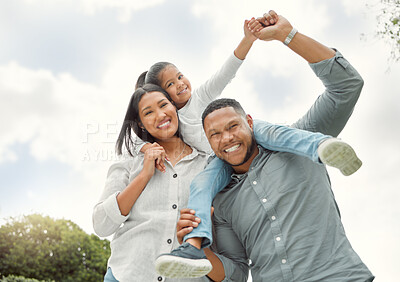 Buy stock photo Shot of parents carrying their daughter outside