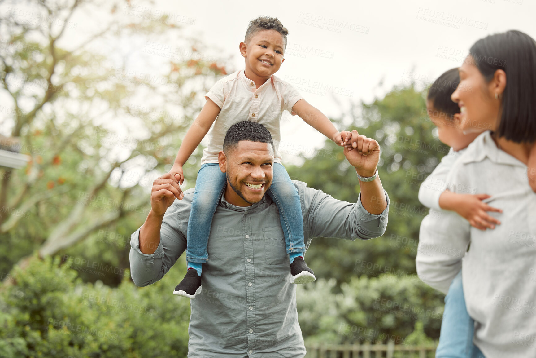 Buy stock photo Shot of a family in the backyard at home