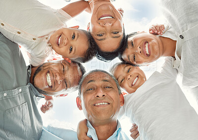 Buy stock photo Shot of a family in a huddle outside